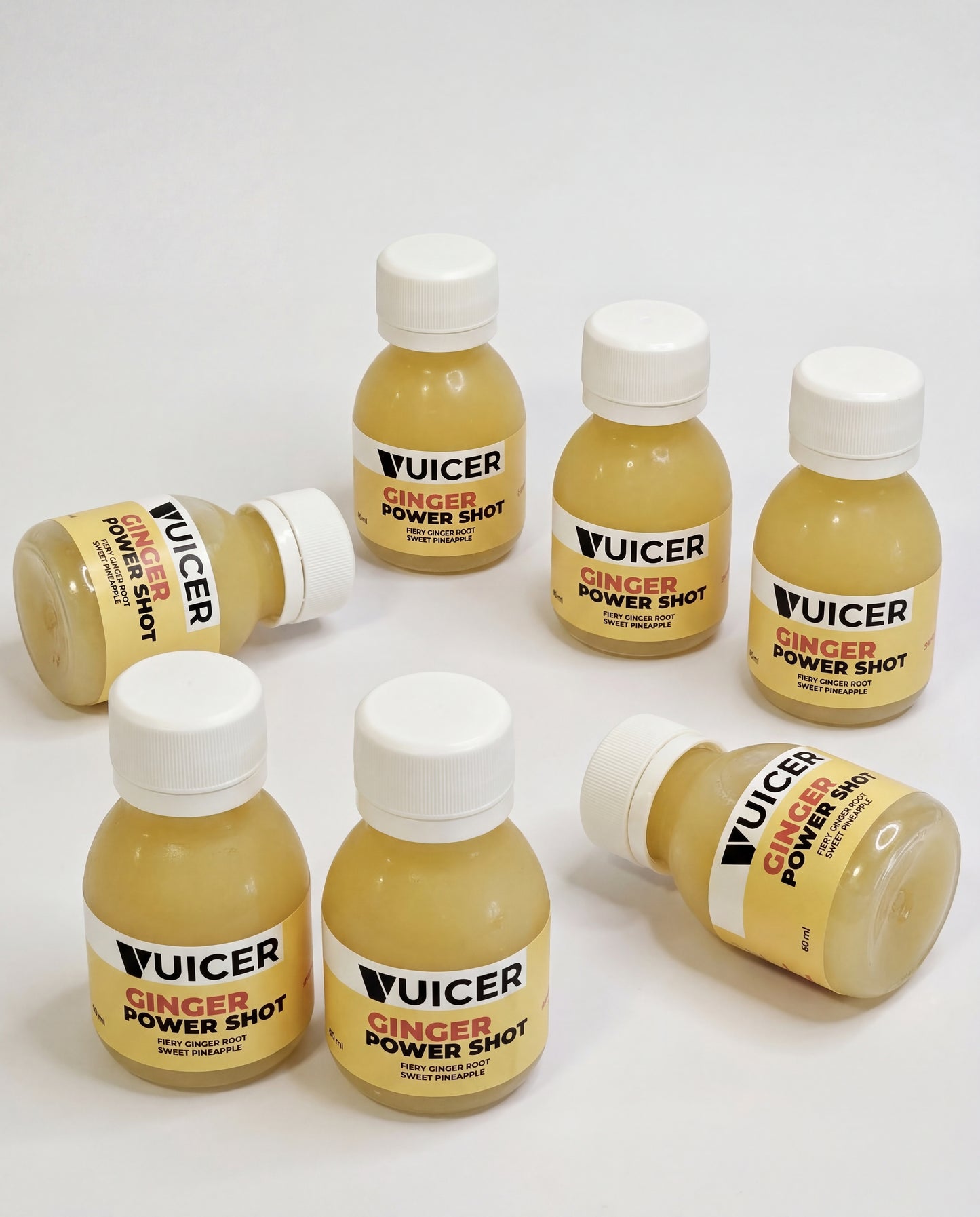 Vuicer Ginger Power Shot bottle with fresh ginger and pineapple
