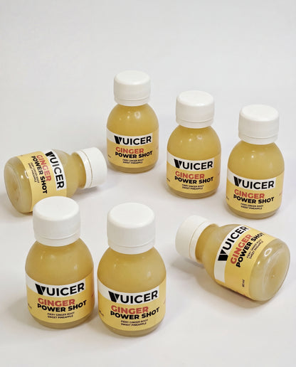 Vuicer Ginger Power Shot bottle with fresh ginger and pineapple